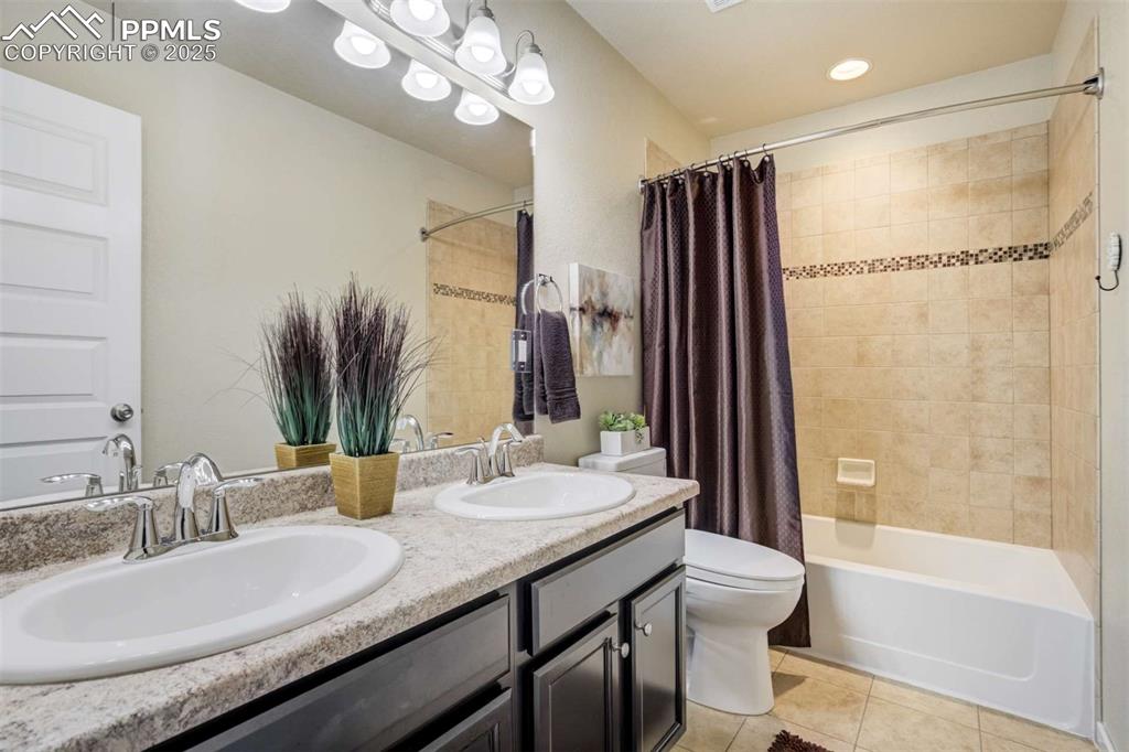 Image 34 of 50: Full Bathroom – Upper-level full bath offering a dual-sink vanity, stylish 