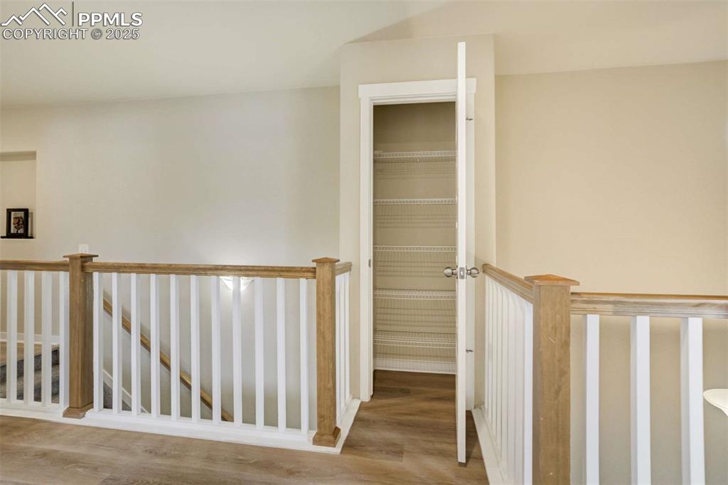 Image 36 of 50: Upstairs Linen Closet – Conveniently located hallway linen closet with buil