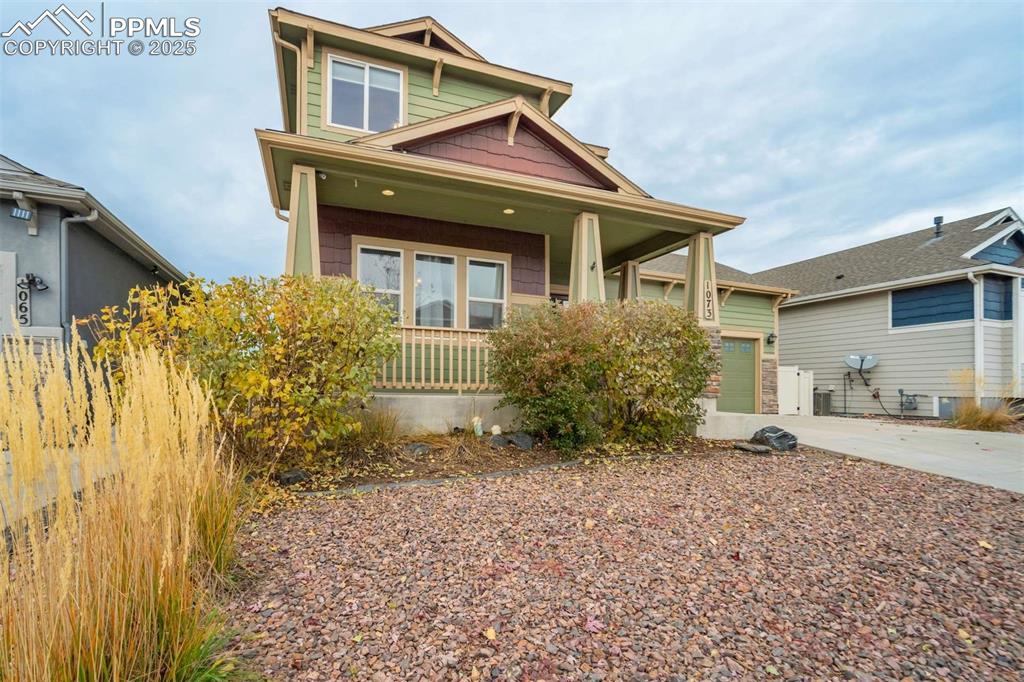Image 4 of 50: Front Exterior, Angled Left – Attractive diagonal view of the porch and fro