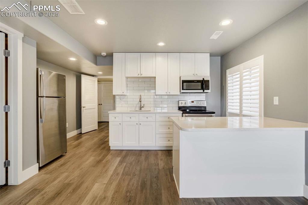 Image 40 of 50: Basement Kitchenette (Appliance View) – Stainless steel appliances, ample c