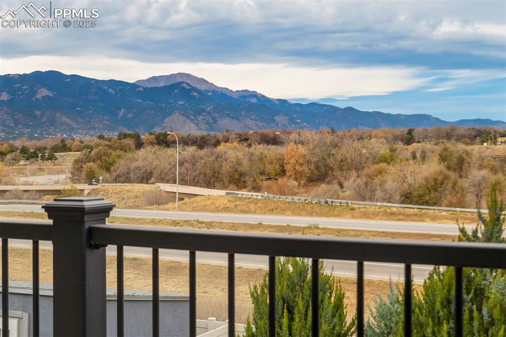 Image 48 of 50: Upper Deck Entry – Beautiful composite deck off the main level, accented wi