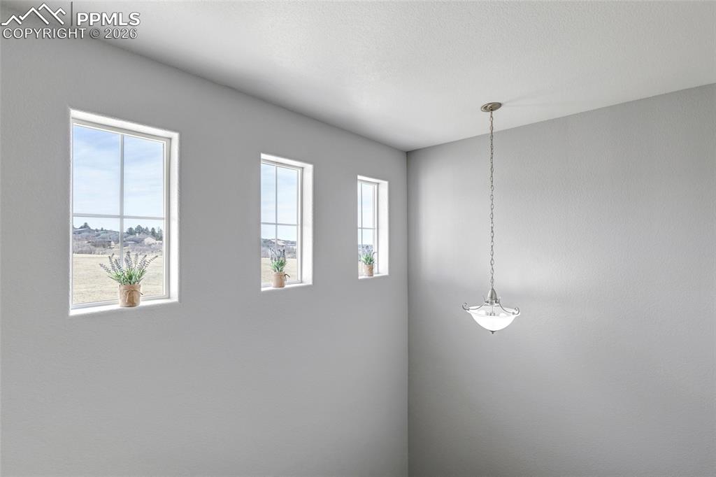 Image 20 of 38: Freshly painted hallway with lots of natural lighting