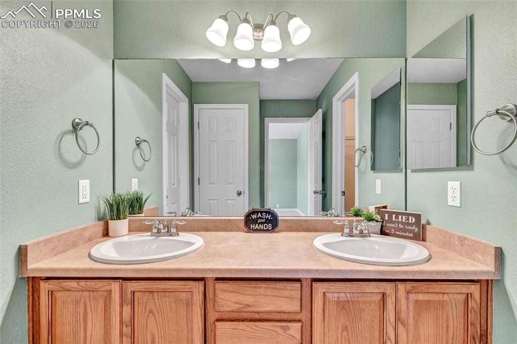 Image 24 of 38: Dual vanity, remodeled shower, separate dessing and bathing areas