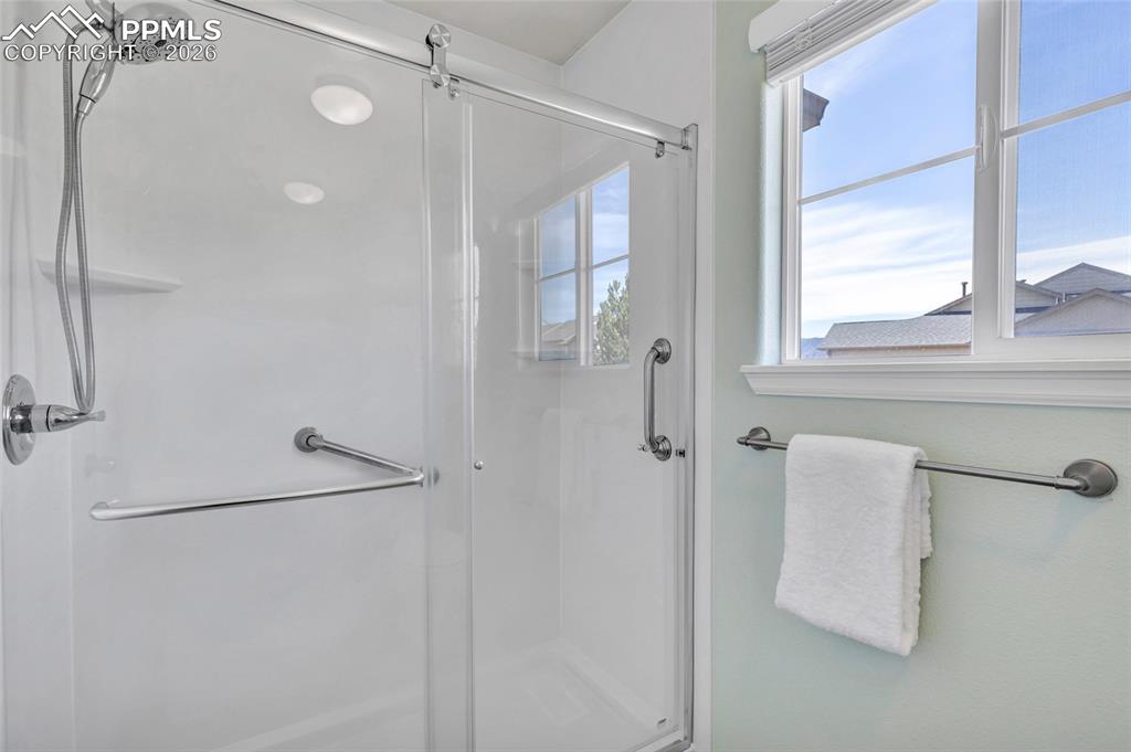Image 26 of 38: Dual vanity, remodeled shower, separate dessing and bathing areas