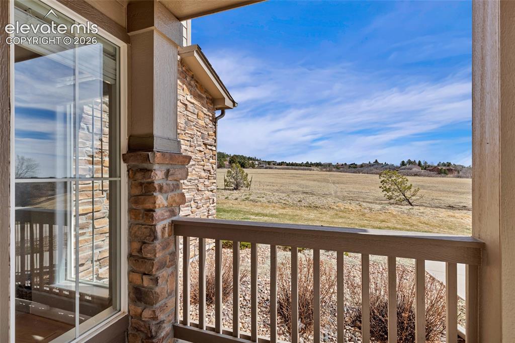 Image 3 of 42: Covered porch with views of open space