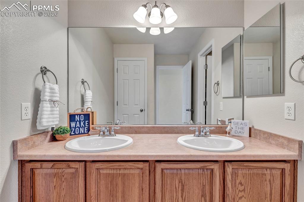 Image 32 of 38: Full bath on second level with separate bathing and changing area