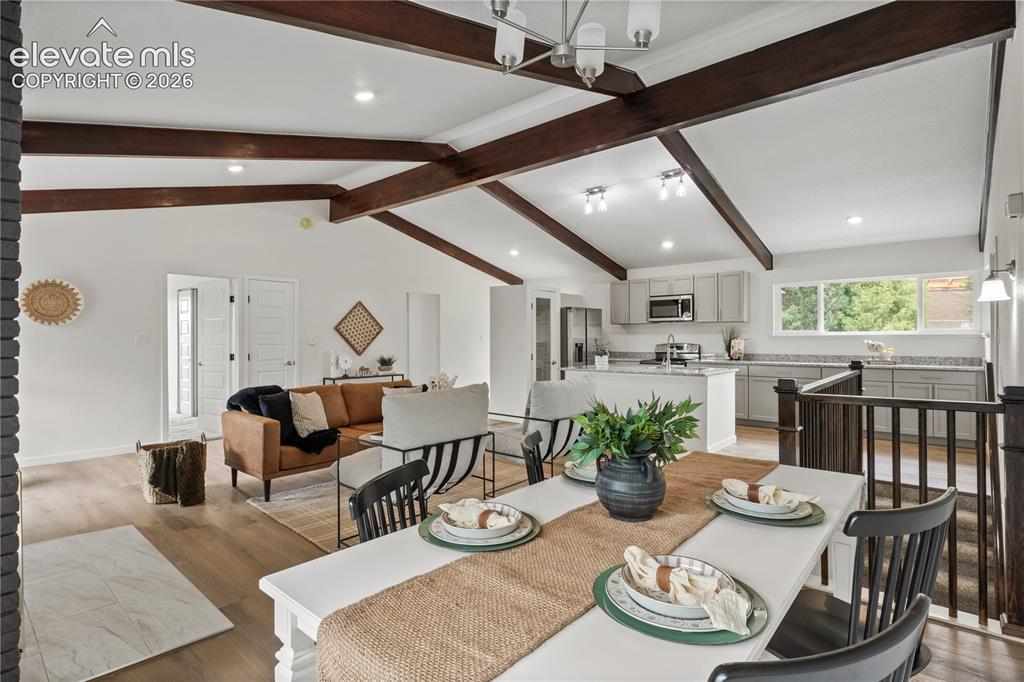 Image 8 of 30: Vaulted ceiling with exposed wood beams