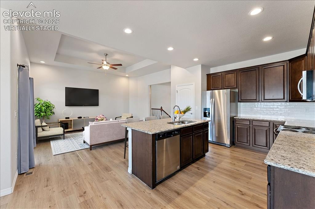 Image 4 of 48: View from the eat-in kitchen area - Virtually Staged