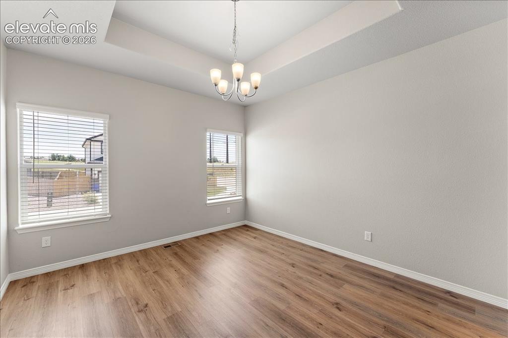 Image 45 of 48: Main level formal dining room, office, flex room