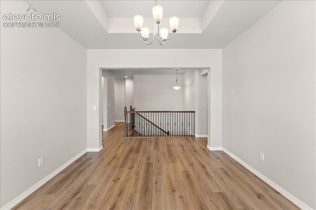 Image 46 of 48: Main level formal dining room, office flex room