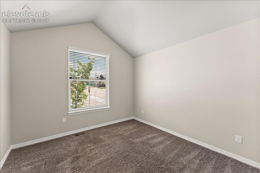 Image 47 of 48: Main level bedroom that is staged as an office