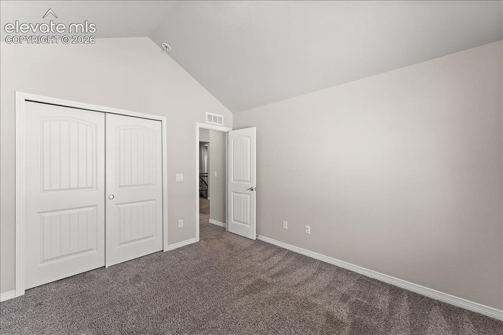 Image 48 of 48: Main level bedroom that is staged as an office