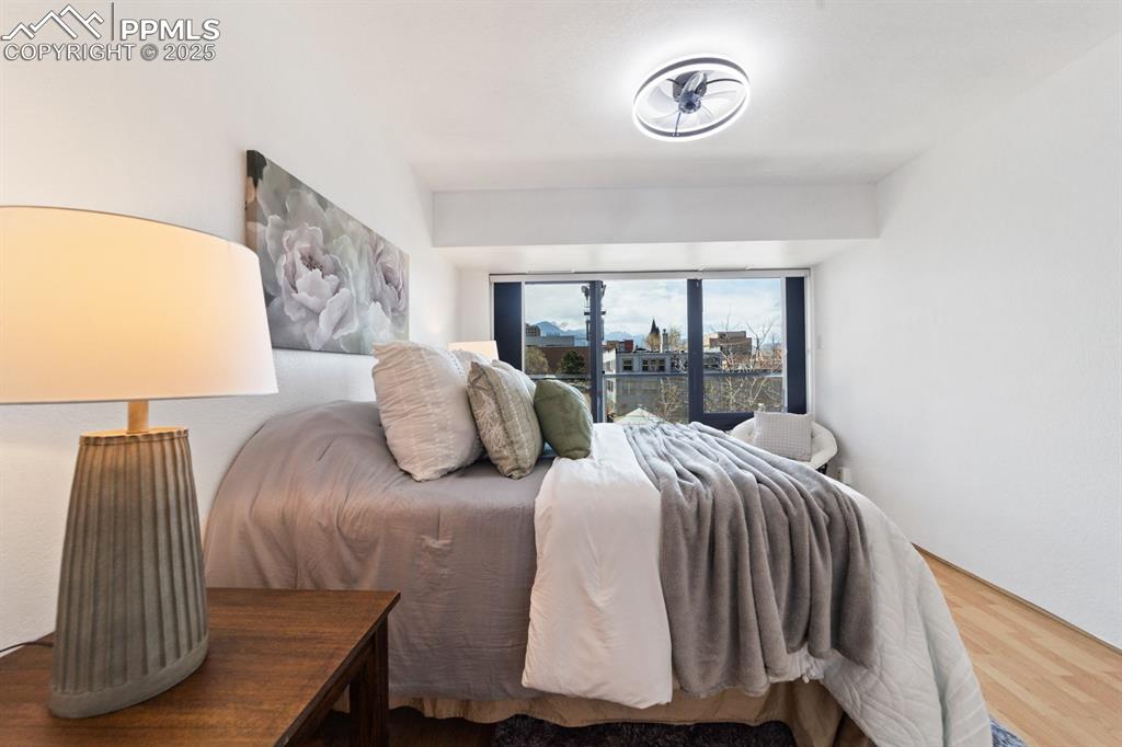 Image 12 of 32: Bedroom featuring wood finished floors