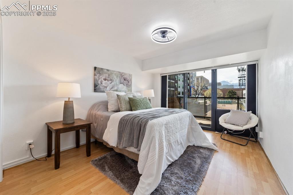 Image 13 of 32: Bedroom featuring light wood-type flooring and access to exterior