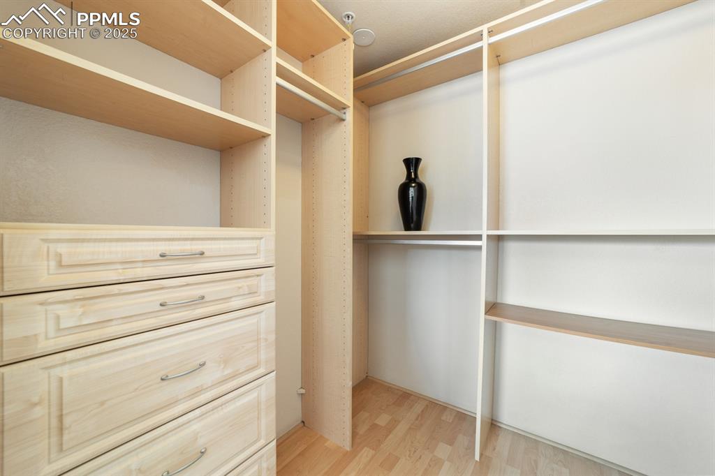 Image 14 of 32: Spacious closet with light wood-style floors