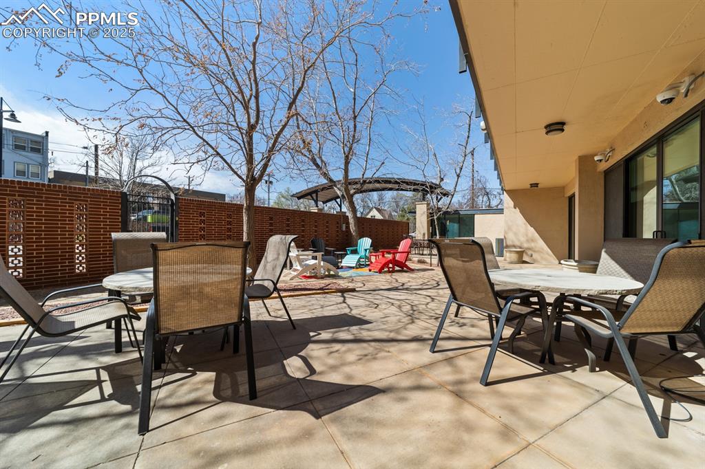 Image 25 of 32: View of patio featuring outdoor dining area