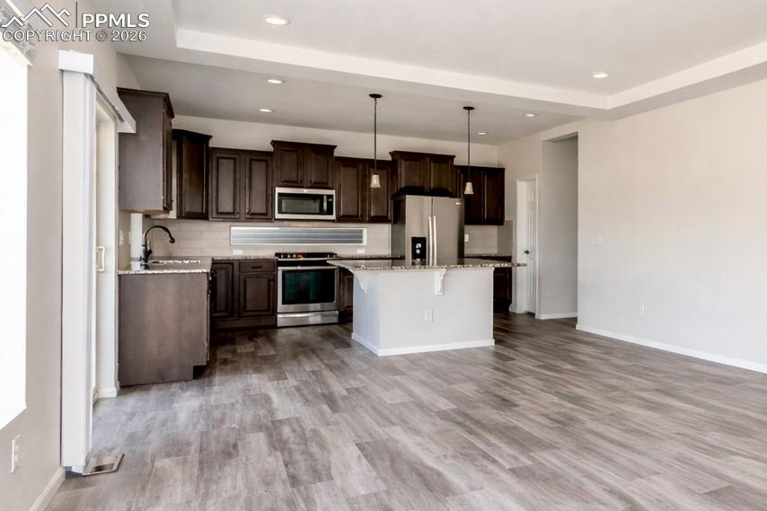Image 13 of 50: Kitchen/Dining Area