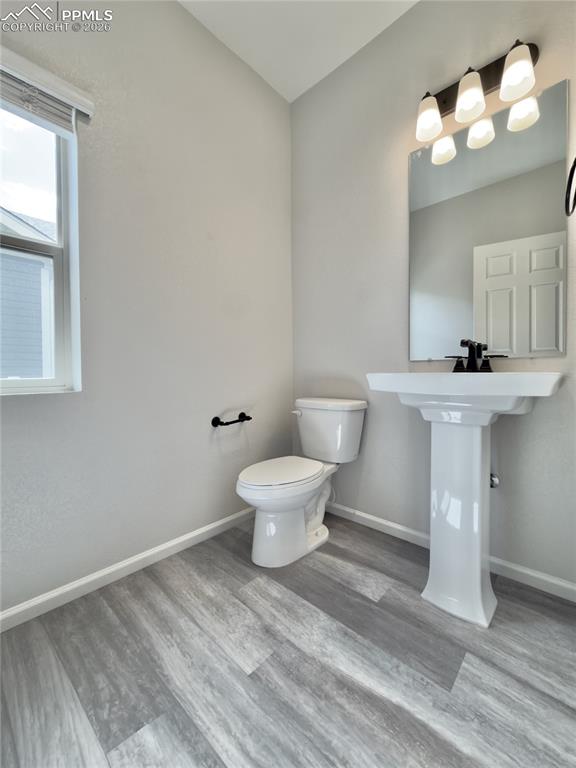 Image 14 of 50: Main-level Powder Half Bath