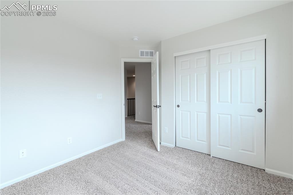 Image 28 of 50: Upper Level Bedroom