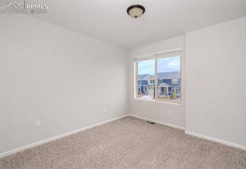 Image 30 of 50: Upper Level Bedroom