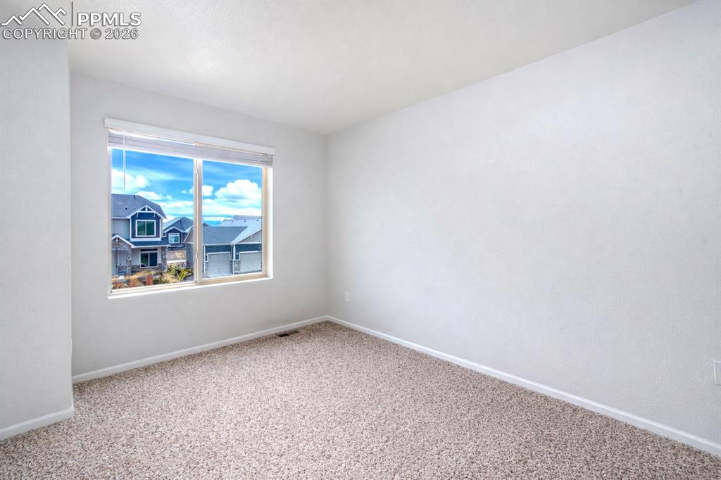 Image 33 of 50: Upper Level Bedroom