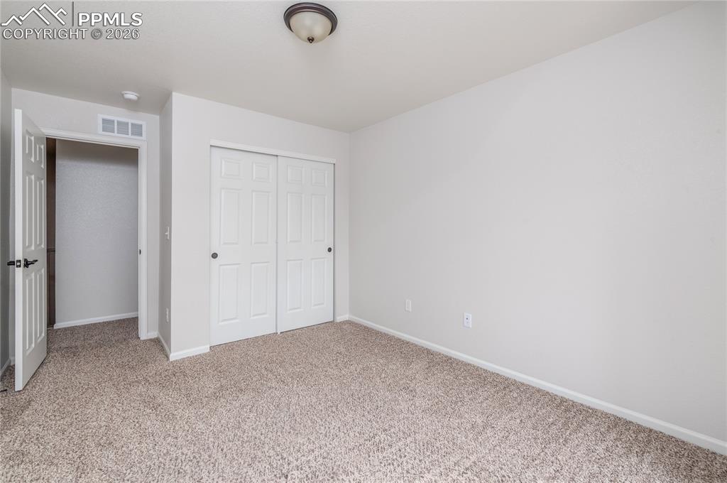 Image 34 of 50: Upper Level Bedroom