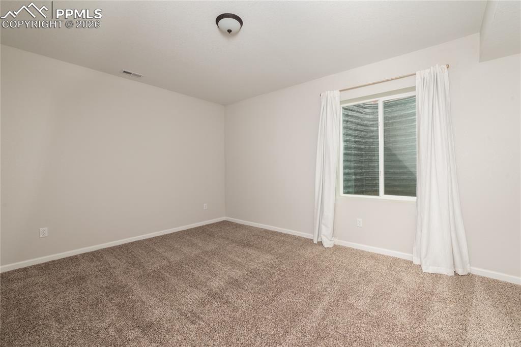 Image 41 of 50: Basement Bedroom