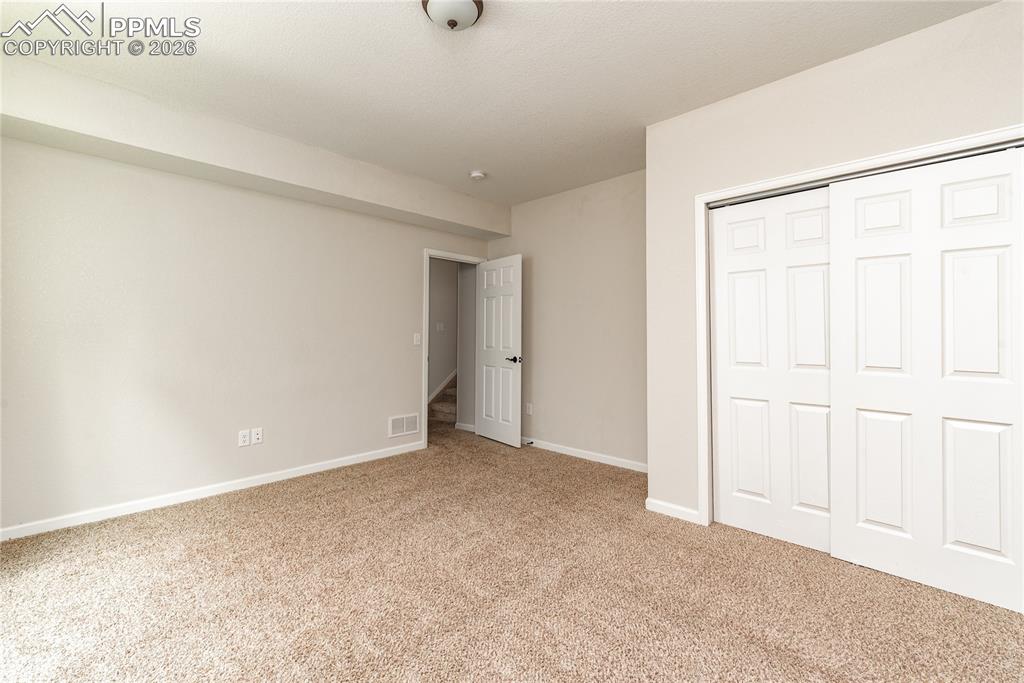 Image 42 of 50: Basement Bedroom