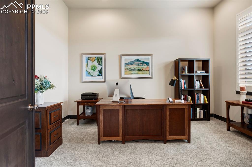 Image 20 of 31: Main-floor office with double door entry.