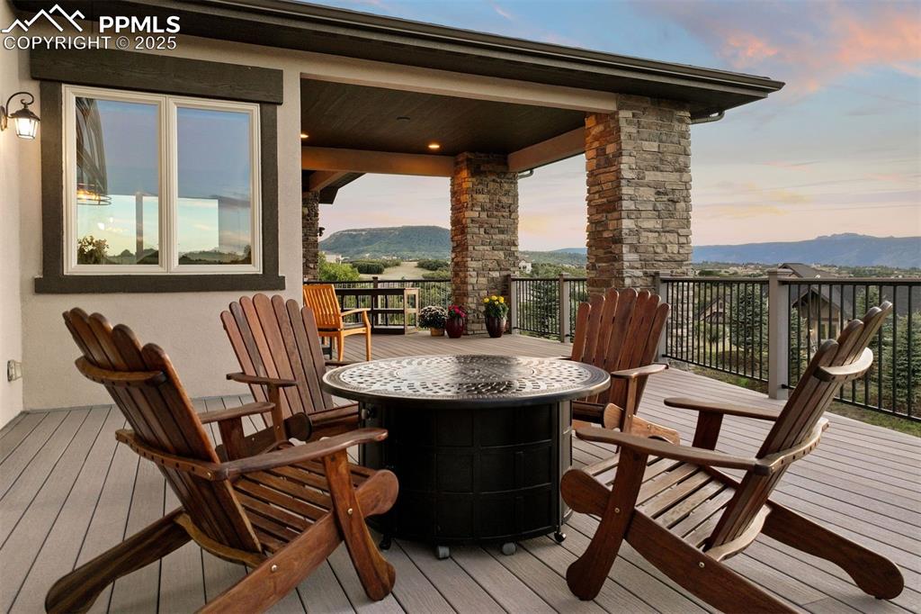 Image 26 of 31: The west-facing deck is fabulous with multiple sitting areas.