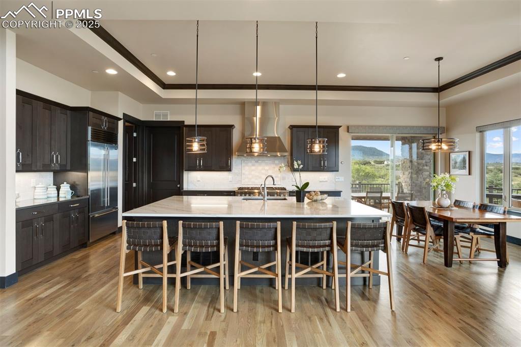 Image 7 of 31: The exceptional kitchen is equipped with Thermador and Sub-Zero appliances,