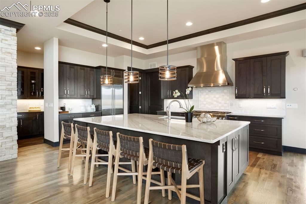 Image 8 of 31: 10-foot center island with seating and ample prep and storage space with wa