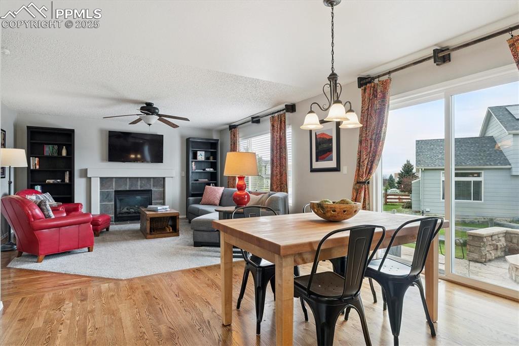 Image 10 of 40: Dining room with plenty of natural light, light wood-type flooring, a tiled
