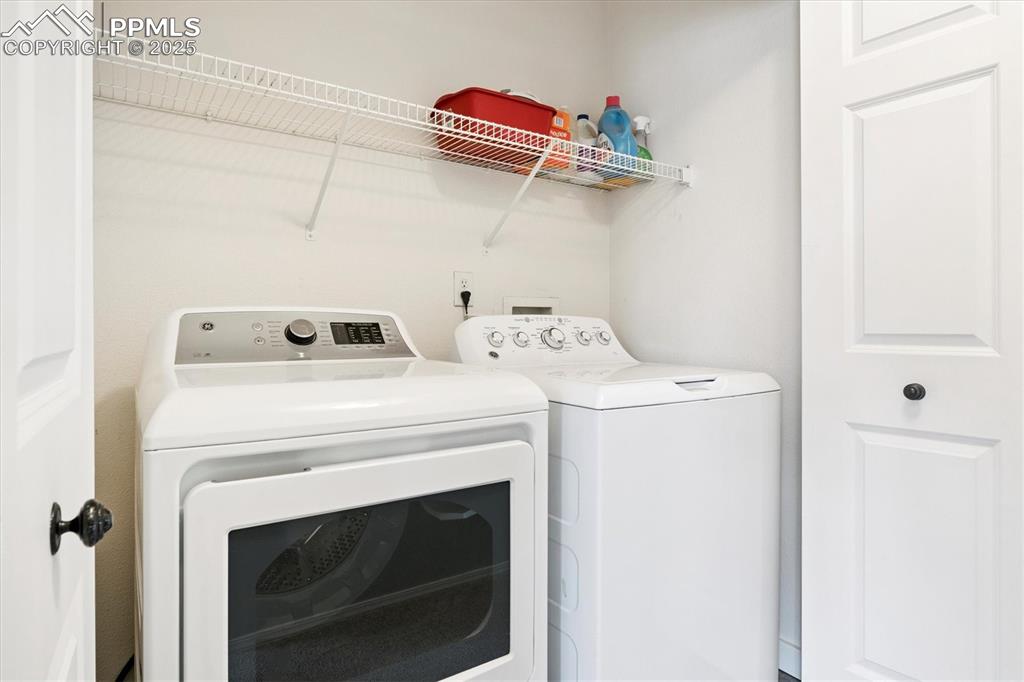 Image 18 of 40: Laundry room featuring independent washer and dryer
