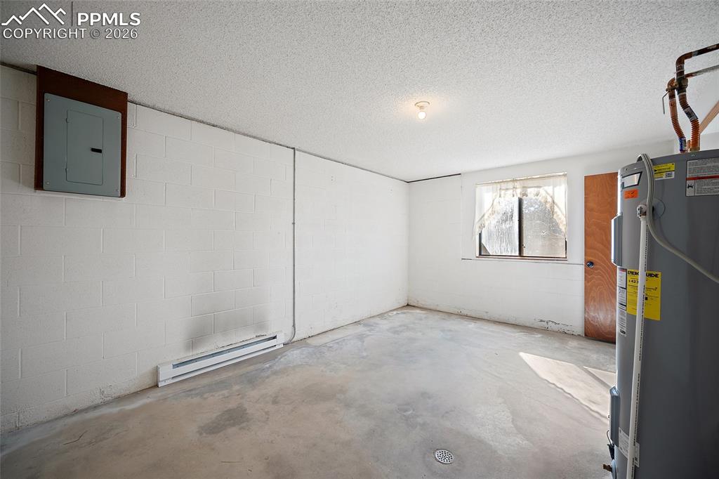 Image 26 of 48: Laudry & storage off the garage