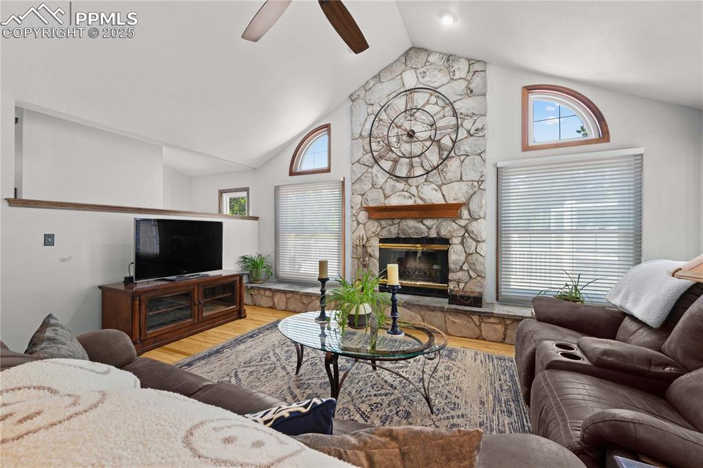 Image 2 of 33: Vaulted ceilings and abundant natural light. Welcoming living room with stu