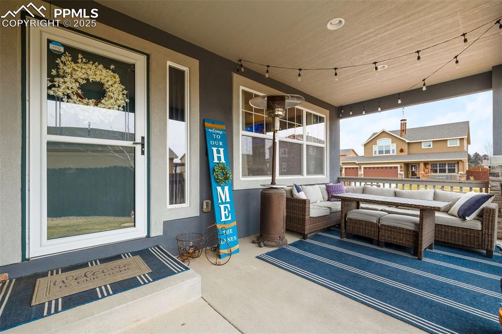 Image 3 of 43: Covered porch featuring outdoor lounge area