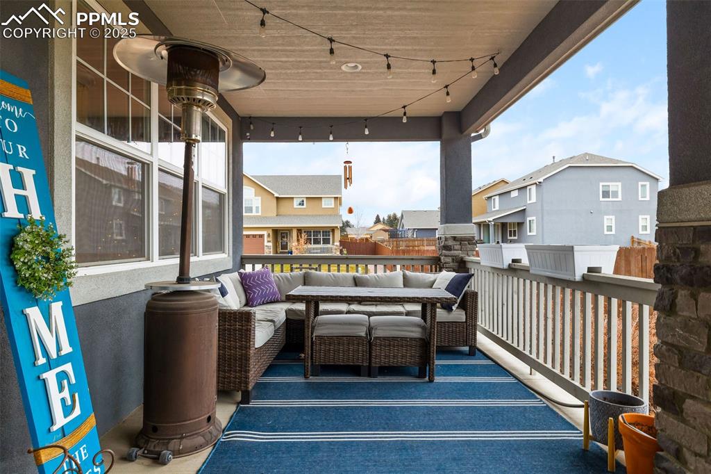 Image 4 of 43: View of patio / terrace featuring an outdoor living space and a residential