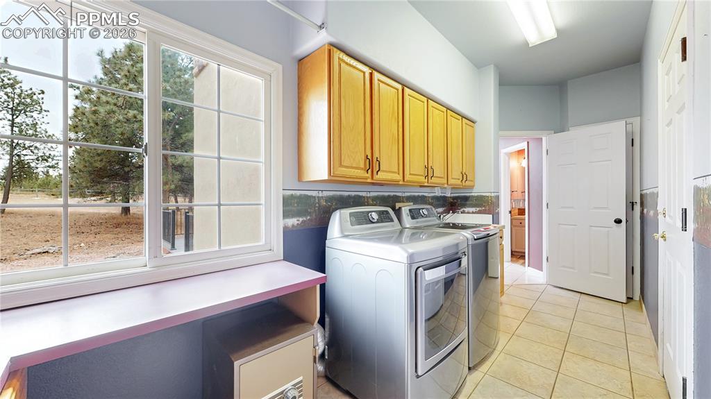 Image 15 of 50: Main level laundry and mudroom area
