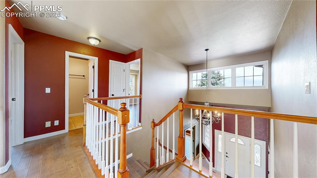 Image 16 of 50: Upper level catwalk to bedrooms