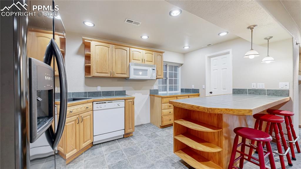 Image 27 of 50: Basement kitchenette