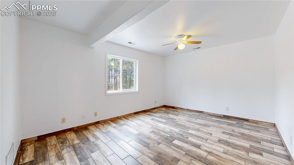 Image 47 of 50: Basement bedroom