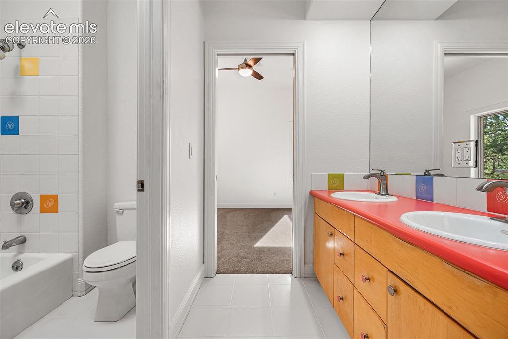 Image 34 of 42: Jack and Jill Full Bathroom on Main Level