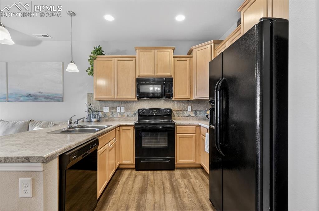 Image 10 of 42: When entering from the garage you come right into the kitchen and dining ar