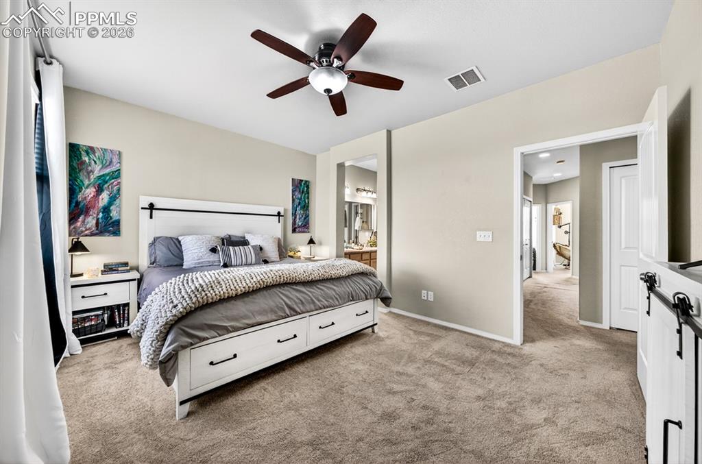 Image 24 of 42: Primary with view to the ensuite and hallway