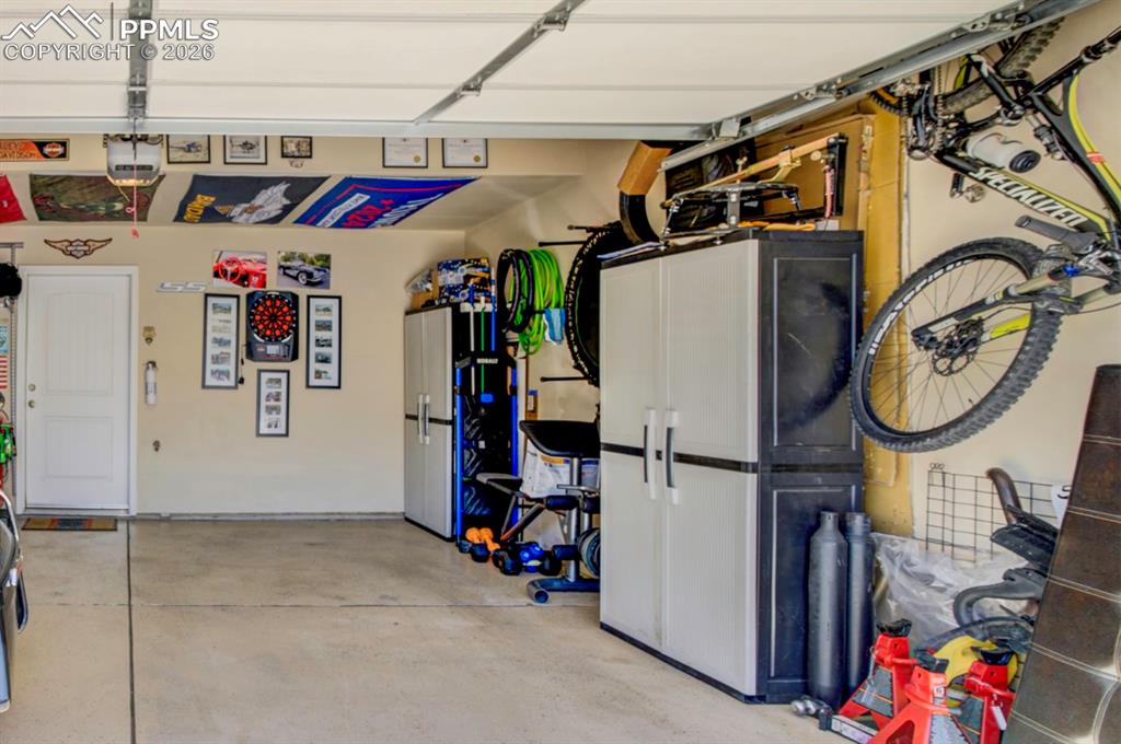 Image 42 of 42: Large 2 car garage with space for all of your storage needs; Epoxy/painted
