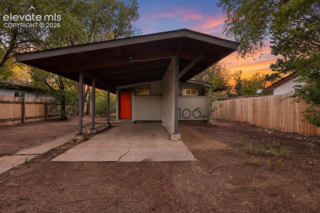 Image 1 of 36: Carport structure featuring a wood-finish ceiling and support columns