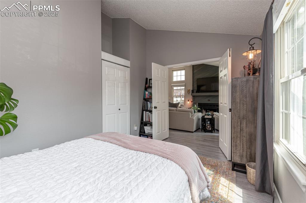 Image 16 of 27: Bedroom with double french doors, closet and high ceilings.