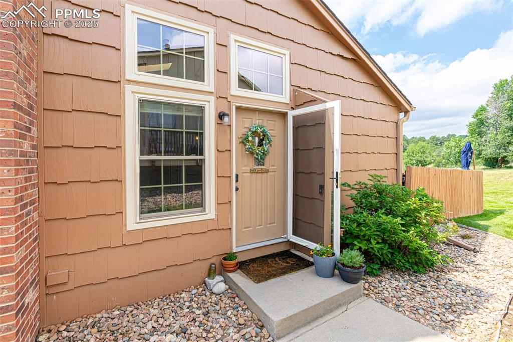 Image 6 of 27: Solid Storm door with lock and screen
