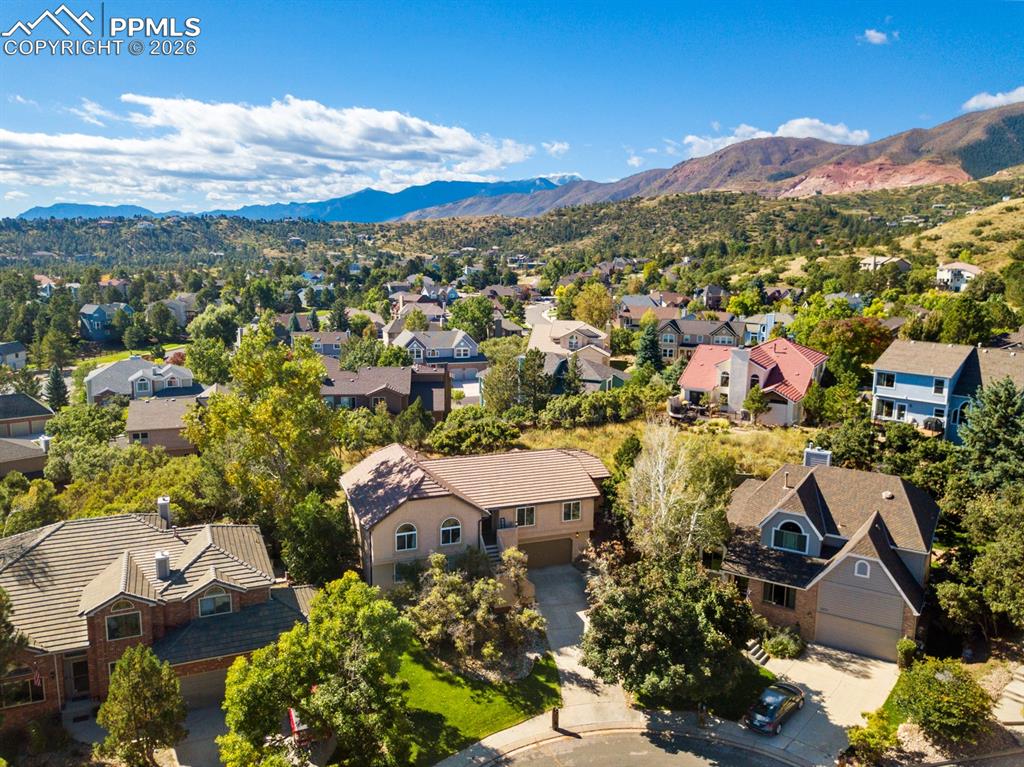 Image 34 of 37: Birds eye view of property with a mountain view